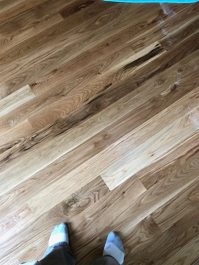 Close view of oak planks, the grain and end joints running away from the camera